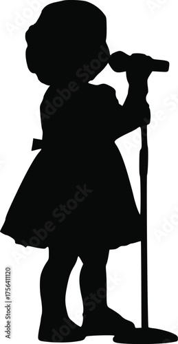Silhouette of a Young Girl Singing Into a Microphone on a Stand, Performing on Stage