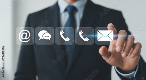 Businessman pressing email icon on digital interface with contact options hand touching