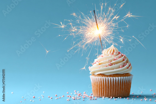 Festive cupcake with sprinkles and a sparkling firework