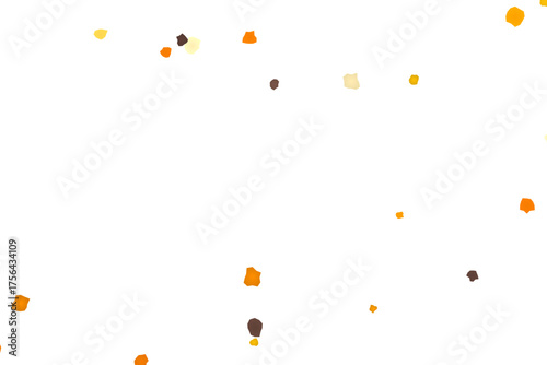 Scattered confetti pieces in warm autumnal colors on a clean white backdrop creating a minimalistic graphic illustration
