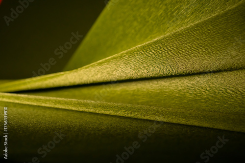 Abstract background made of crepe paper in shades of green