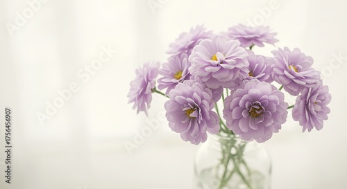 Bouquet of delicate purple flowers in a glass vase