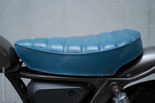 Close up of a vintage blue motorcycle seat on a custom bike