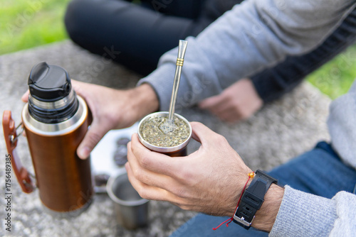 Fotografía Close up of hands preparing and holding hot mate beverage