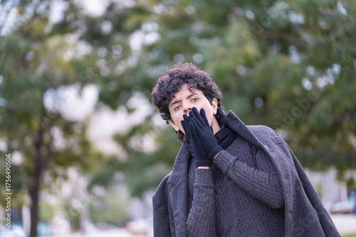 Aesthetic fall street style: guy in a high-neck sweater and elegant dark jacket