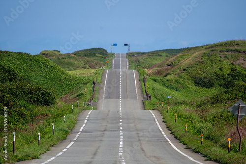 A road with many ups and downs through the hills