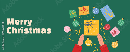 Holiday banner with hands holding gift boxes, surrounded by Christmas decorations, baubles, and confetti on green background. Ideal for festive greetings, winter sale banners, and web design