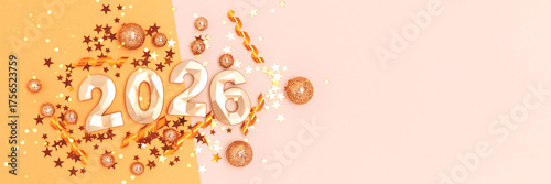 2026 New Year creative concept. Golden numbers and shiny confetti on a beige background.