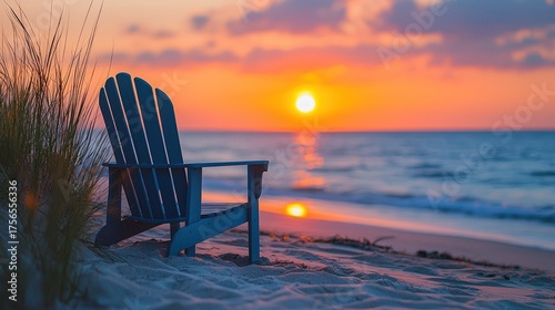 Serene beach sunset with Adirondack chair, tranquil ocean view.