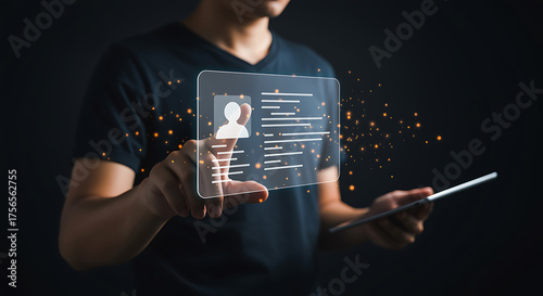 A man is holding a transparent screen with a profile and text on it, representing digital identity, online profile, personal data, and access control with modern technology
