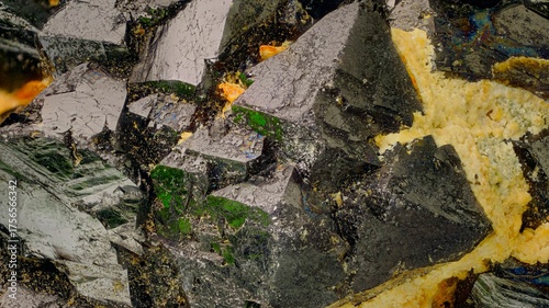 Macro magnetite crystals at 3.7x — black iron mineral with iridescent sheen. Key subject for geology, metallurgy and paleomagnetism