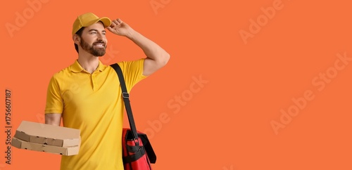 Male courier holding pizza ...