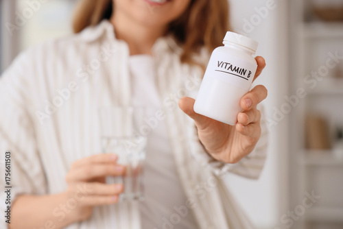 Young woman with vitamin B ...