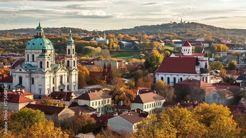 Prague Autumn Panorama: Church, Rooftops, and Golden Foliage in a Scenic European Cityscape