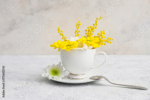 Cup with beautiful flowers,...