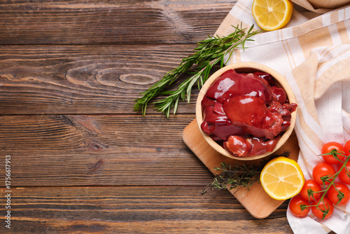 Raw chicken livers in woode...