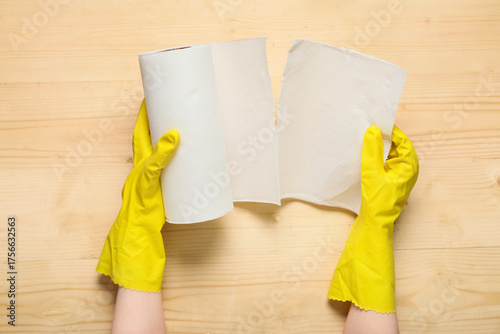 Woman in rubber gloves tear...