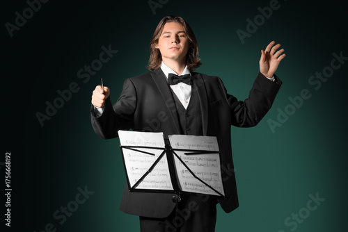 Male conductor with note sh...