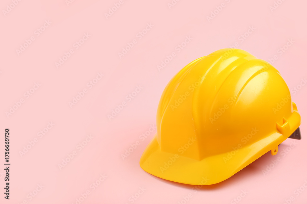 Fototapeta premium Hardhat on pink background, closeup