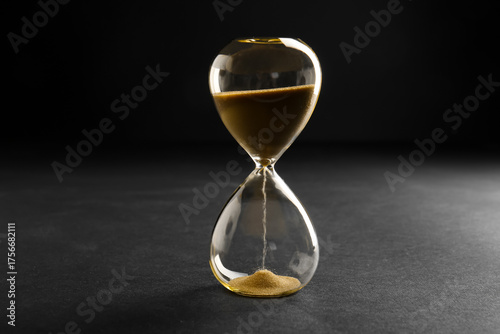 Hourglass with yellow cryst...