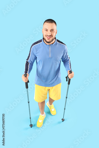 Sporty young man with walki...