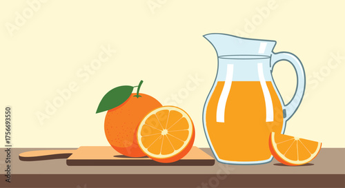 Freshly squeezed orange juice in a pitcher with whole and sliced oranges on a cutting board.
