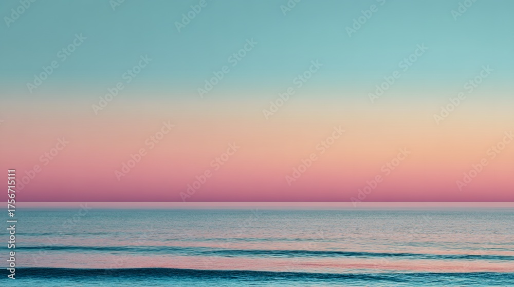 Obraz premium Horizon divides ocean and sky in soft pastel sunset hues.