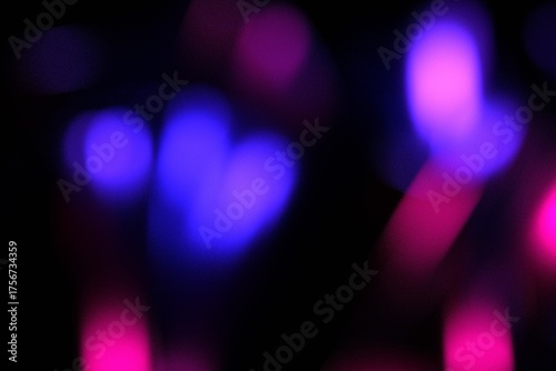 An abstract background featuring vibrant bokeh light effects on a dark gradient.