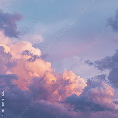 Vibrant sunset sky filled with fluffy pink and purple clouds