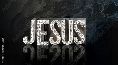 name of Jesus sign with shiny stone rock letters and dark background