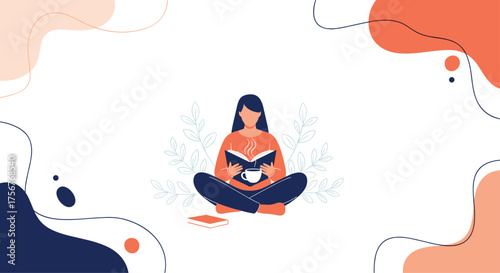 A person sits cross-legged reading a book with a cup of tea.