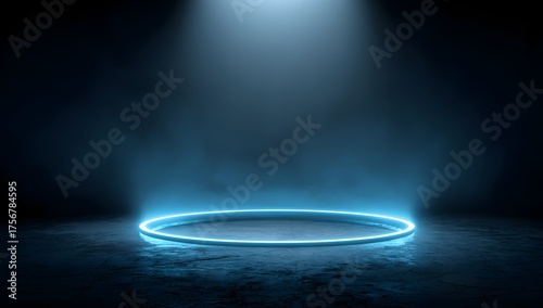 Illuminated circular platform bathed in a dramatic blue spotlight on a textured dark surface