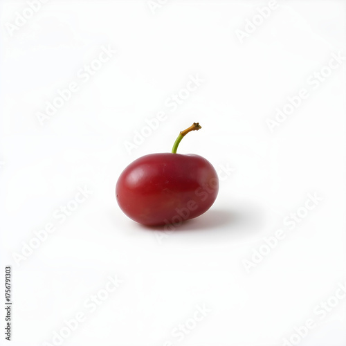 A solitary red grape is placed at the center of a pristine white background