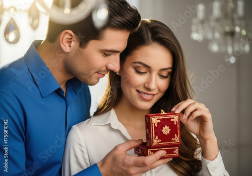 Man surprises woman with a beautiful jewelry gift box on a special occasion