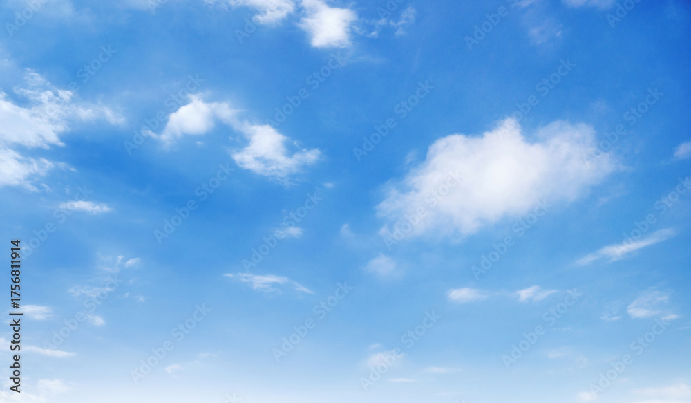 Fototapeta premium sky is blue and clear with few clouds scattered throughout