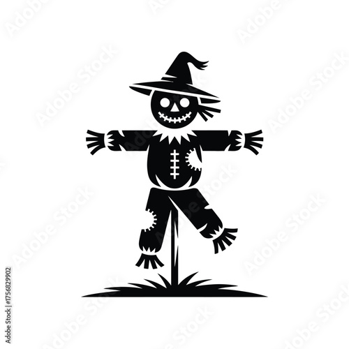 Spooky black silhouette scarecrow with hat and grinning face