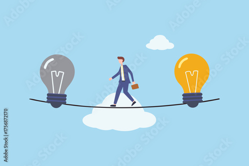 Businessman walking a tightrope between a lit and unlit lightbulb with clouds in the sky