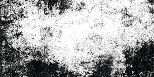 Grunge black and white distressed texture with scattered speckles and blotches for abstract background or overlay design.