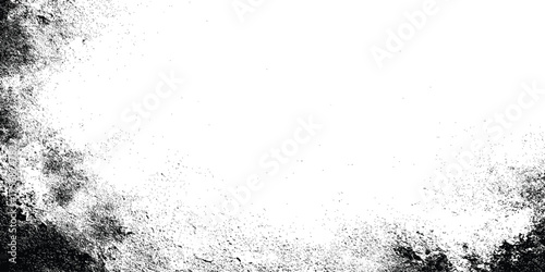 Grunge black and white distressed texture with scattered speckles and blotches for abstract background or overlay design.