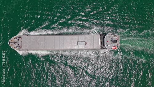 Container ship. Export and import. Cargo business. Empty barge. Cargo ship with container at sea, aerial view. Freight cargo vessel for container. Cargo ship vessel leaving port. Commercial transport