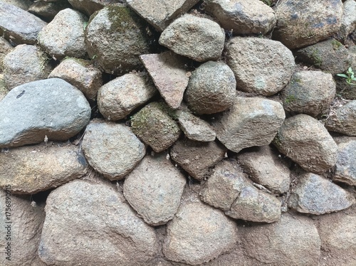 Stack of natural stones with rough texture and gray-brown tones.