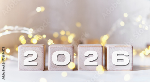 New year 2026 on wooden cubes. Star lights