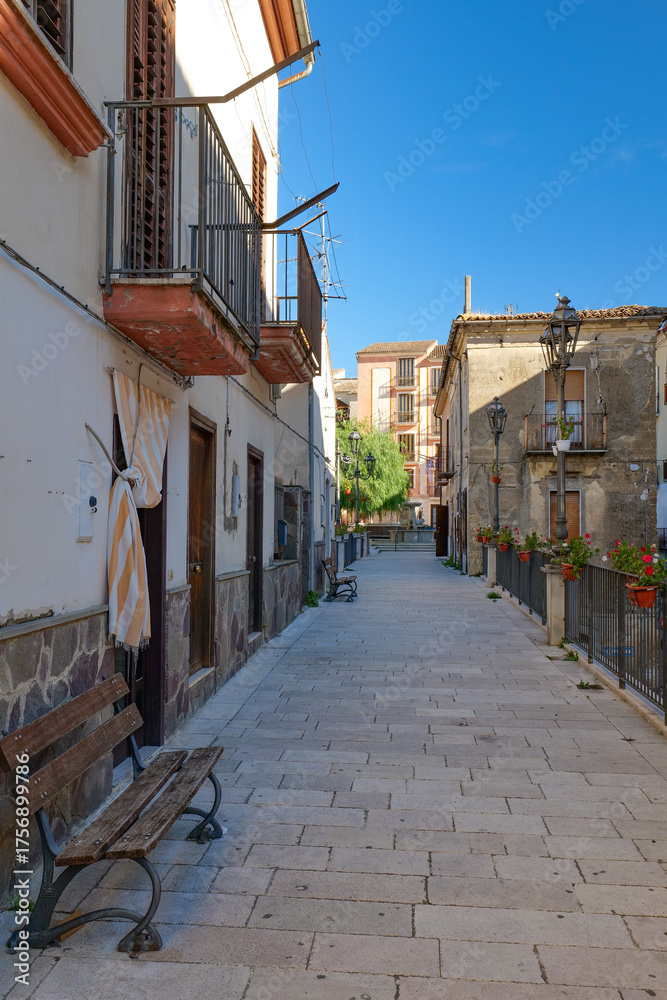 Fototapeta premium A narrow street among the old houses of Altavilla Irpina, a village in the province of Avellino, Italy.