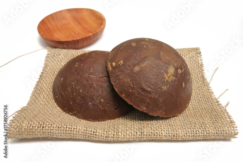 Palm Sugar on Burlap Fabric Isolated on White Background