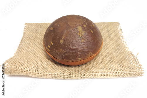 Palm Sugar on Burlap Fabric Isolated on White Background
