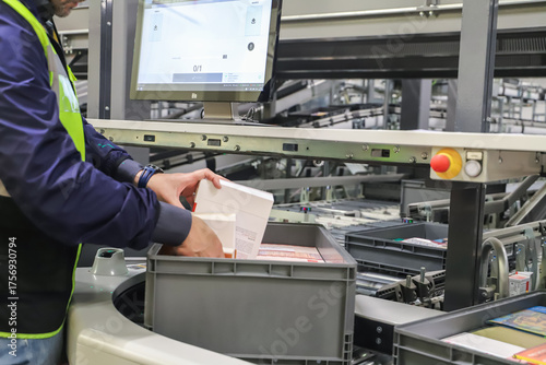 picking. packing line in a logistics warehouse. conveyor belt in a modern production line