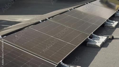 Modern rooftop solar array on a tall building, highlighting sustainable city infrastructure.