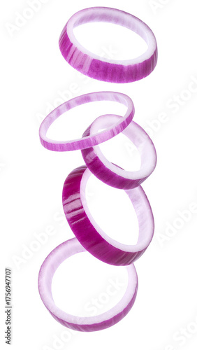 Falling red onion rings creating dynamic movement. Sliced purple vegetable preparing fresh healthy cooking ingredients