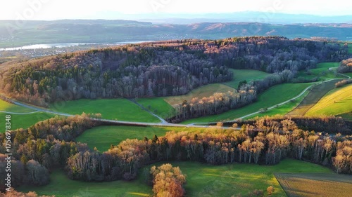 Valley with forests and fields on the banks of the river Rhine in the sun
