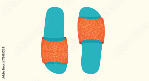 A stylish pair of turquoise slides with intricately patterned orange straps resting on a cream background.